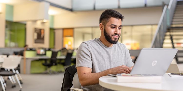 Student using laptop.