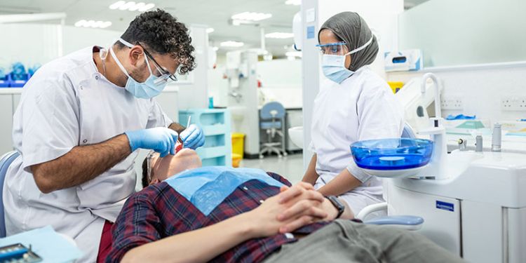 Image of students using the facilities in the clinical suite