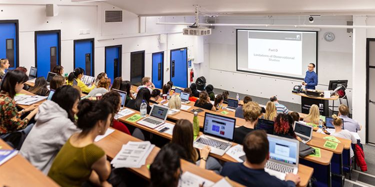 Psychology lecturer teaching postgraduate class
