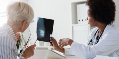 2 scientists looking at x ray