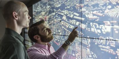 University of Leeds staff working on a digital screen
