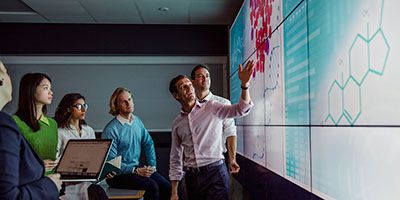 Academic pointing at research representing research and innovation at the School of Psychology