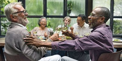 elderly group sitting chatting representing  Successful ageing psychology research at the University of Leeds
