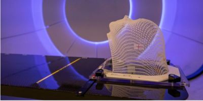 Patient Radiation proton therapy fixing mask showing laser lines for targeting cancer cells in the brain