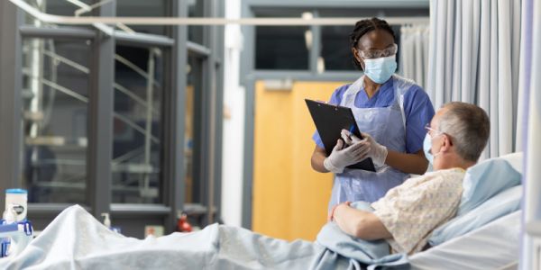 Medicine student looking after patient