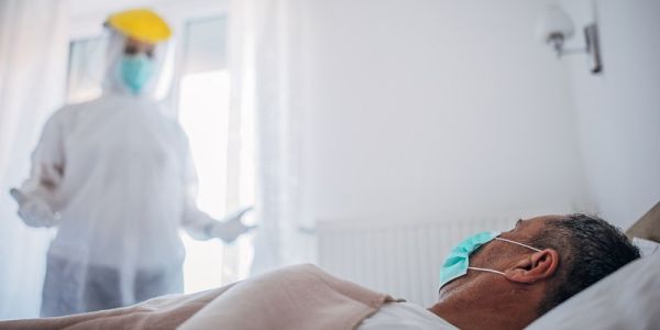 healthcare professional struggling to communicate with patients whilst wearing full PPE