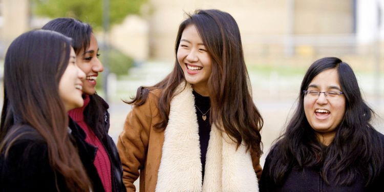 International students walking across campus the University of Leeds