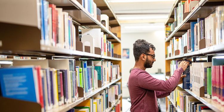 PhD research student in the library