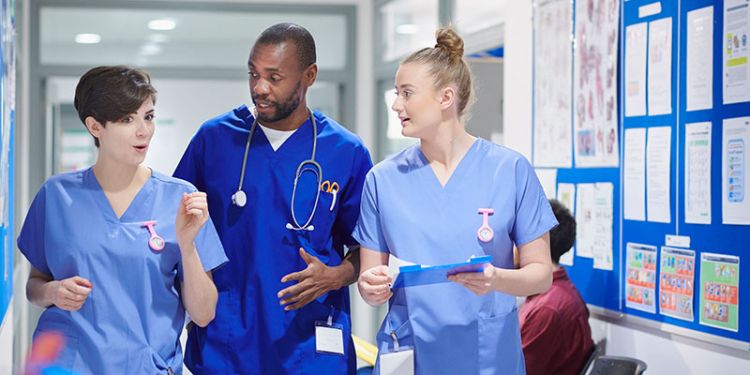 3 students in a clinical practice setting representing The Academic Foundation programme offered at the University of Leeds.
