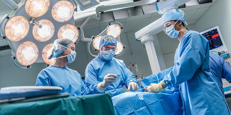Surgeons in operating theatre