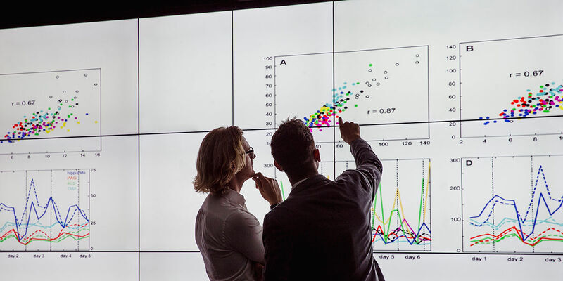Healthcare professionals looking at graphs
